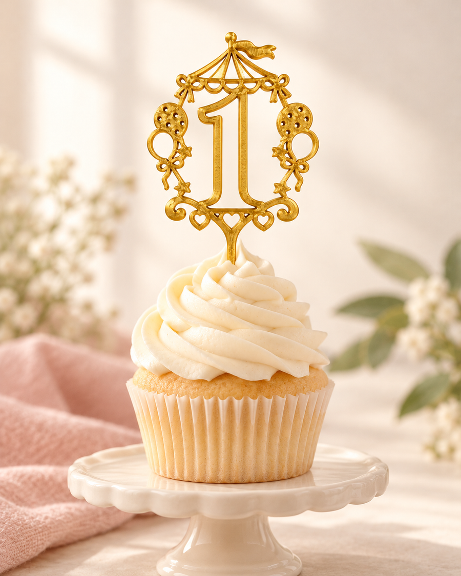 Gold number 1 cupcake topper displayed on an ivory frosted cupcake