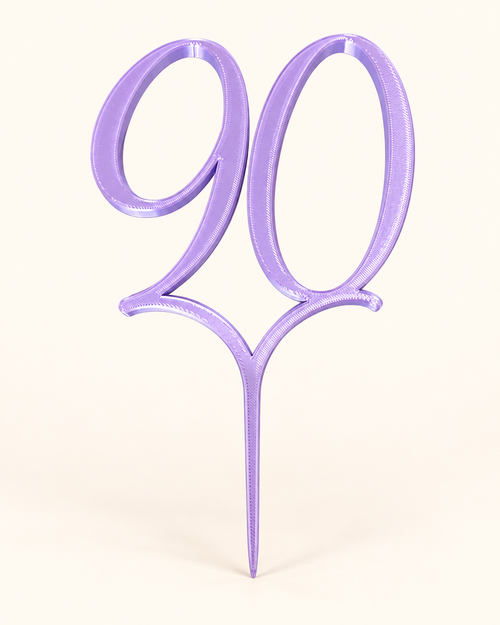 Purple custom number 90 centerpiece pick on a cream background